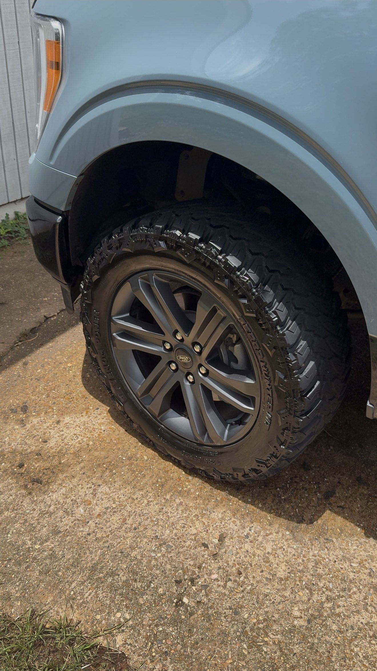 Ford F-150 wheel and off-road tire cleaned and dressed